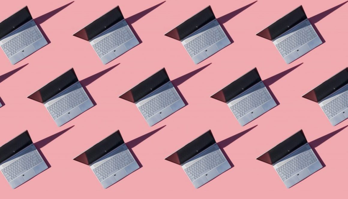 Laptops on pink background